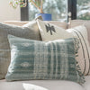 Sage bhujodi pillow cover with fringe styled on counch