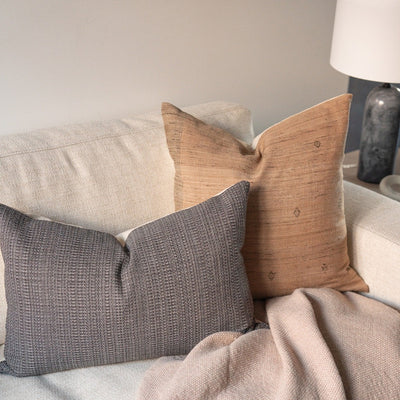 Mocha Tussar pillow cover styled on couch with cool texture