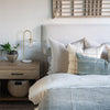 Oatmeal linen double sided pillow covers on bed with cool neutrals