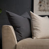 Ester Thai woven pillow cover styled on couch with charcoal accent