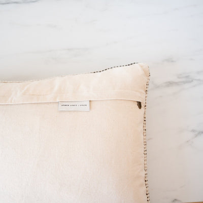 Neutral pillow with creamy backing with concealed zipper
